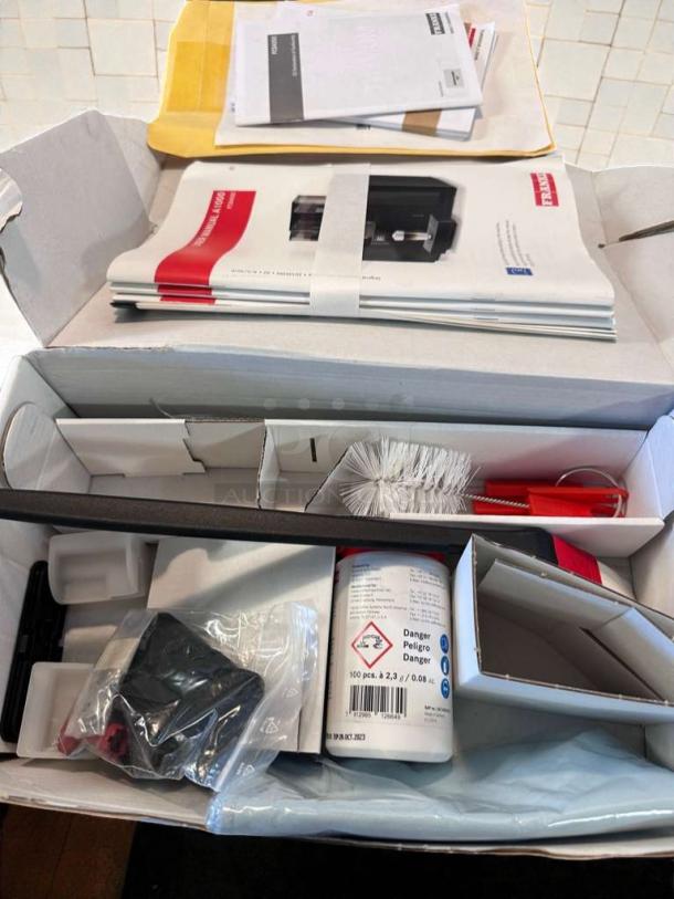 Brand new Franke A1000 FCS4050 commercial coffee machine, accessories included, UL/NSF listed, manuals visible.