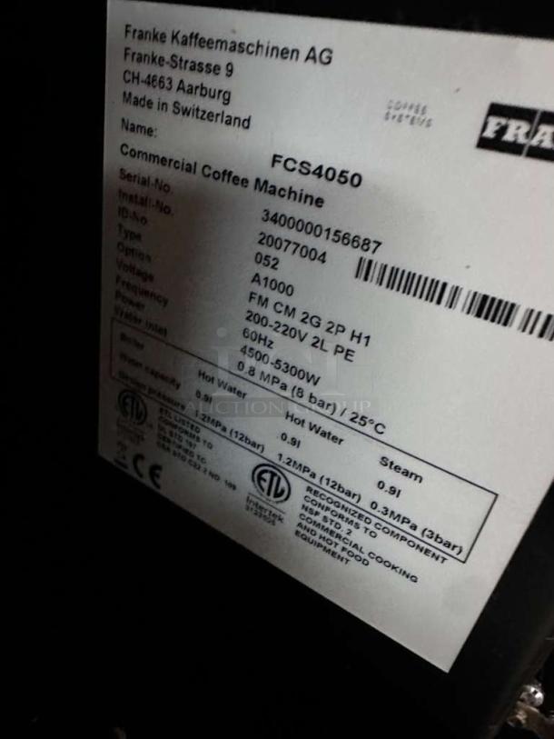 Franke A1000 FCS4050 commercial coffee machine label, showing model, serial number, and power specifications. UL/NSF listed.
