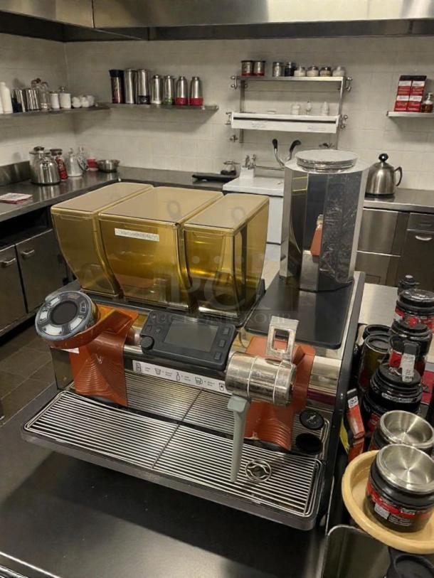 Commercial espresso machine with integrated grinder, 220V, by Commercial Espresso Manufacturer, model Integrated Espresso Grinder System, in premium condition, fully tested and working.