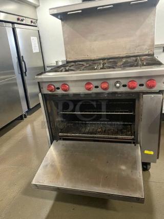 American Range commercial gas range with 6 burners and oven, red knobs, stainless steel, fully tested, premium condition.