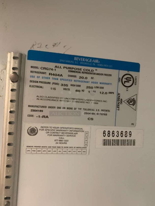 Label on Beverage-Air CRG74-1 refrigerator shows model, refrigerant type, voltage, and warranty details.