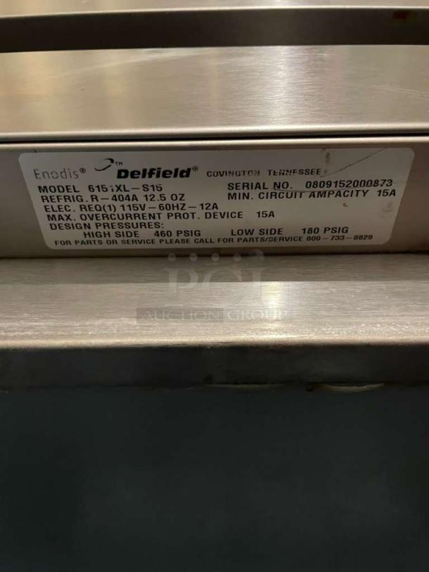 Delfield 6151XL-S15 label showing model, serial no. 0809152000873, 115V specs, made in Covington, Tennessee.