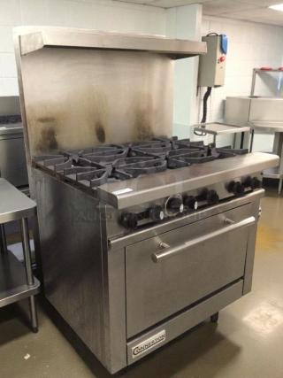 Connerton 6-burner gas range with oven in exceptional condition. Stainless steel, natural gas, fully tested and operational.