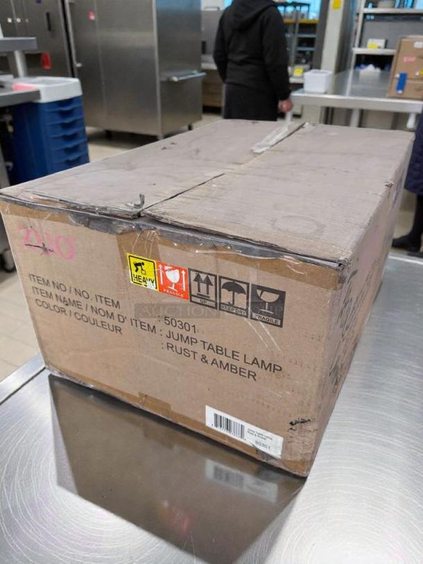 Box for Zuomor Jump Table Lamp Set, 3-Light Rustic Amber Glass, new in original packaging with model number 50301.