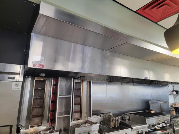 16-foot Econ-Air Commercial Kitchen Exhaust Hood Model 5424-EX2. Stainless steel, high-volume capacity, professional removal required.