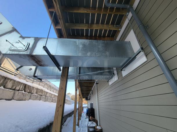 16-foot Econ-Air 5424-EX2 commercial kitchen exhaust hood, professional-grade ventilation system, mounted outdoors.