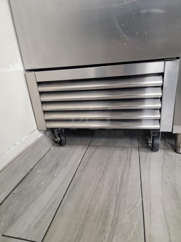 True T-23-HC stainless steel reach-in refrigerator with bottom vent and heavy-duty casters, in pristine condition.