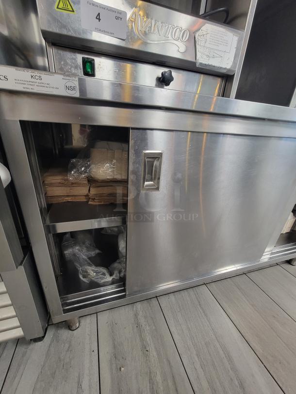 Commercial KCS 415 stainless steel work table with sliding doors, 5' x 30" workspace, adjustable shelving, NSF certified.