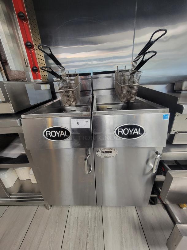 Pair of Royal REEF-35 deep fryers, stainless steel, 24,000 BTU/hr, natural gas, with baskets, clean, professional-grade.