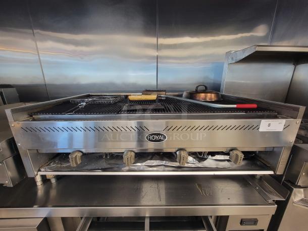 Royal 4' NG Charbroiler, Model RRB-48, with 4 burners and cast iron grates. Includes accessories. Used, good condition.