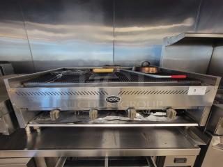Royal 4' NG Charbroiler, Model RRB-48, with 4 burners and cast iron grates. Includes accessories. Used, good condition.