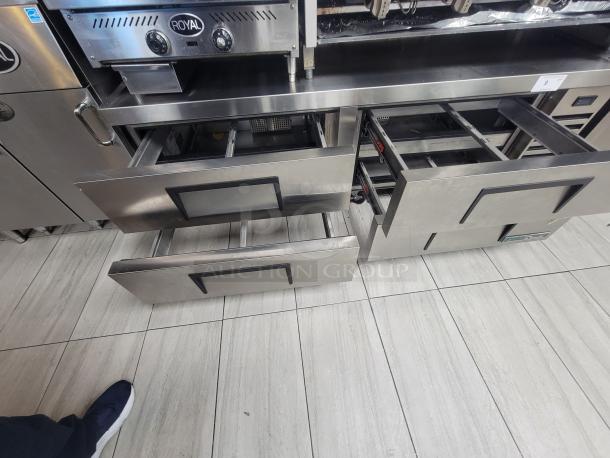 True TRCB-72-HC chef base, 72" stainless steel top, 4 drawers, built-in casters, like new condition for heavy kitchen equipment.