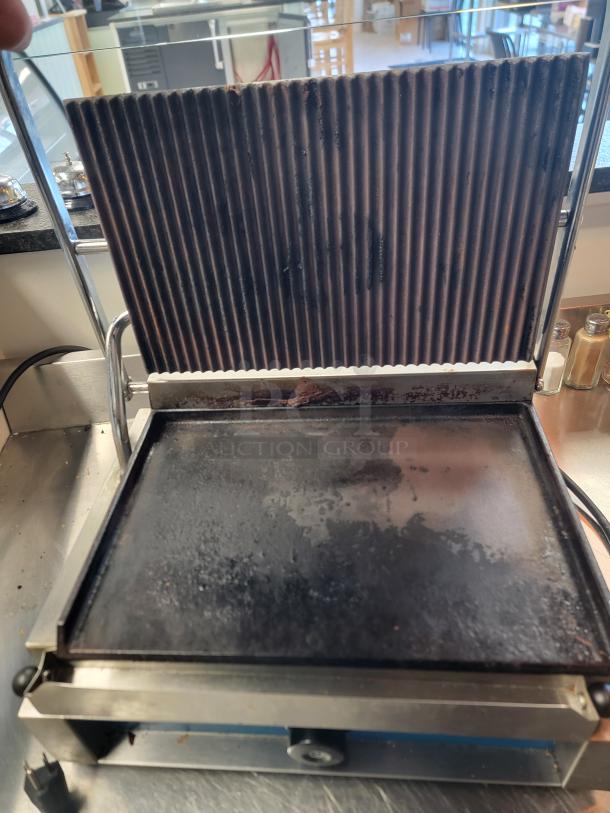 Rocket RC-GH-811EC commercial panini press with grooved top plate and smooth bottom, used condition, ideal for high-volume use.