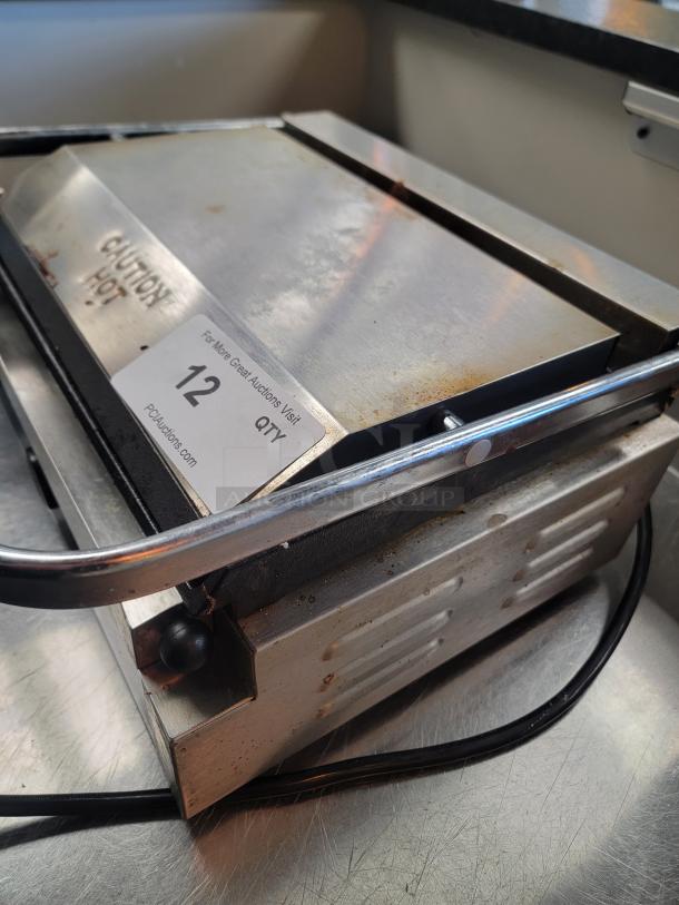 Rocket RC-GH-811EC commercial panini press; grooved top, smooth bottom plate, temperature dial, power lights, minor wear.
