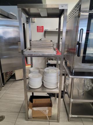 Heavy-duty stainless steel kitchen shelving unit with sheet pans, ceramic plates, bowls, and multi-tier rack, perfect for commercial use.