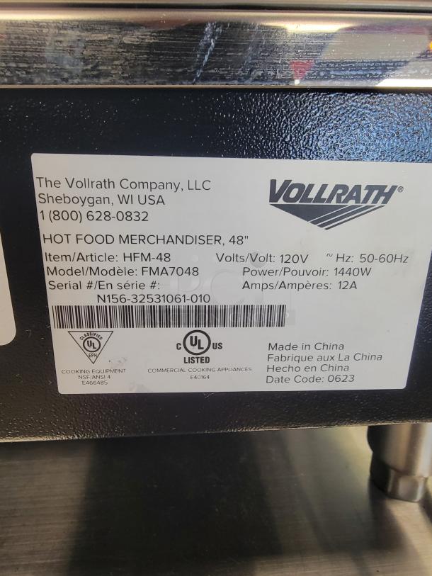 Vollrath HFM-48 Hot Food Merchandiser, 48", black finish, adjustable shelves, precise controls, tag shows model and UL listing.