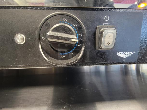 Vollrath HFM-48 hot food merchandiser control panel with temperature dial and power switch, black finish.