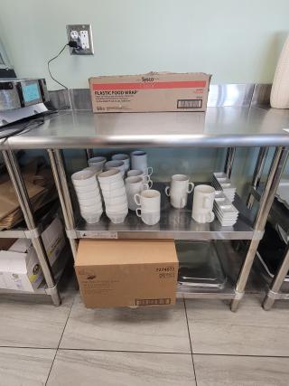 Commercial 3' Prep Station, KCS WT-2436 stainless steel work table with Sysco food wrap, Earth Plus bags, ceramic mugs, ramekins.