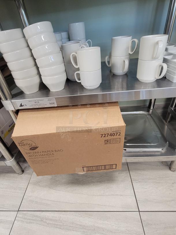 KCS WT-2436 stainless steel prep table with ceramic mugs, ramekins, Sysco Earth Plus bags box, ready for café or catering.