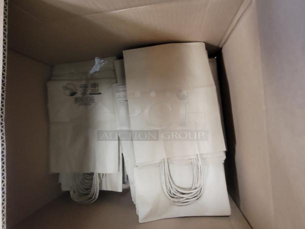 Bulk supply of Sysco Earth Plus handled paper bags in a box, part of a commercial prep station bundle. Bags are clean and organized.