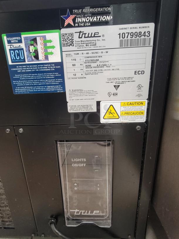 True TGM-R-48-SC/SC-B-W Refrigerated Display Case label, featuring RCU Technology and power settings, in excellent condition.