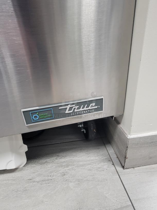 True TUC-36-HC under-counter fridge, stainless steel, dual doors, casters, eco-friendly cooling, excellent condition.