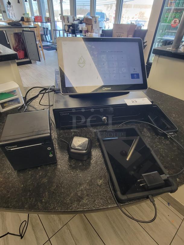 Toast POS system bundle with touchscreen, receipt printer, cash drawer, card reader, and tablet. Great condition for business use.