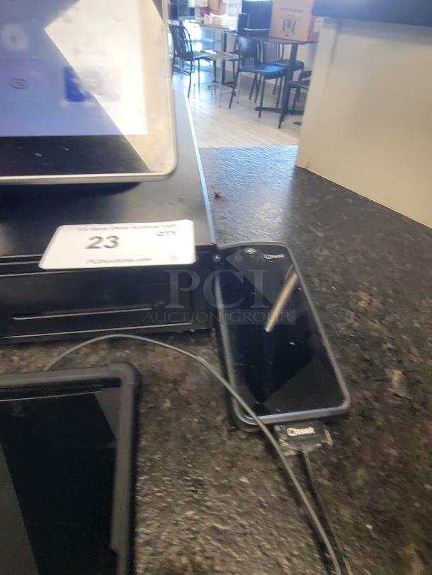 Toast POS system with touchscreen display and card reader on a countertop. Great condition, ideal for retail use.