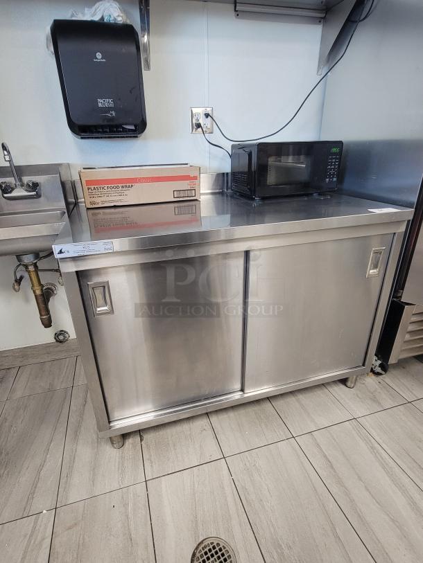 KCS Commercial Stainless Steel Prep Table with sliding doors, interior shelf, digital microwave, and plastic food wrap. Model 415.