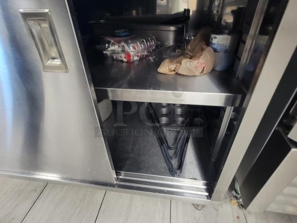 KCS Stainless Steel Work Table with sliding doors; includes pots, pans, muffin tins; model 415, excellent condition.