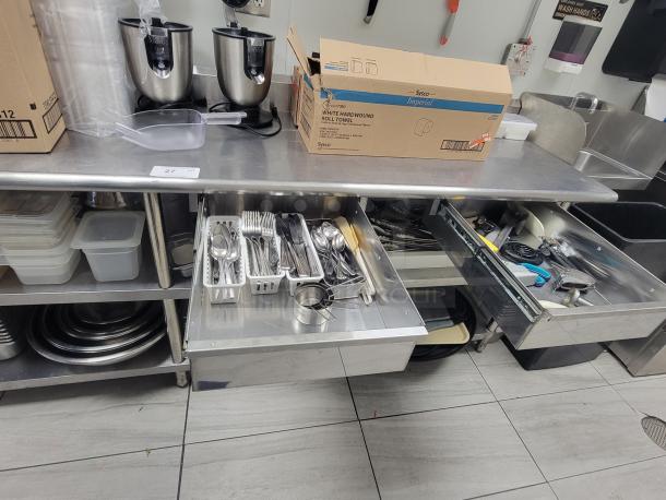 9-foot Sapphire Professional Series stainless workstation with drawers, utensils, and undershelf. Ideal for commercial use.