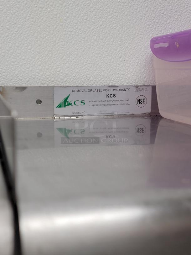 KCS stainless steel wall shelf, model WSSL-24X, NSF-certified. Includes olive oil, hot sauce, honey, storage containers.