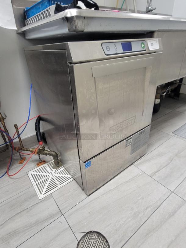 Hobart LXe high-temp sanitizing commercial undercounter dishwasher in stainless steel with digital controls, gently used.