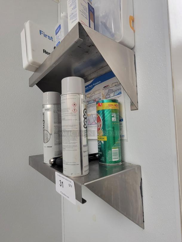 Keystone Wall-Mount stainless steel shelves with first aid kit, biohazard response kit, isopropyl alcohol, and cleaning supplies.