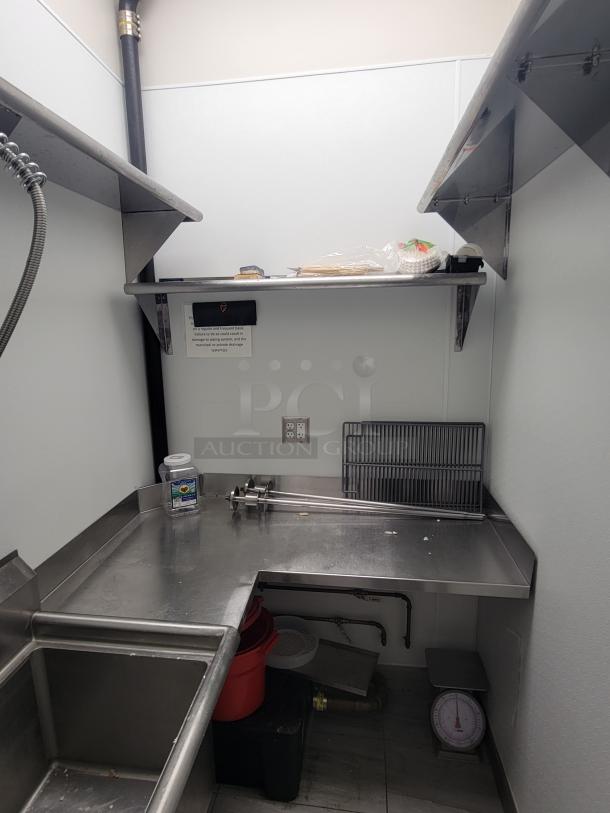 Commercial kitchen dish station with stainless steel prep area, sink, and shelves. Includes KCS and Sapphire equipment.