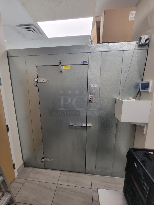 Norlake walk-in cooler and freezer combo in excellent condition. Includes wall-mounted condensing units and Metro shelving. Made in USA.