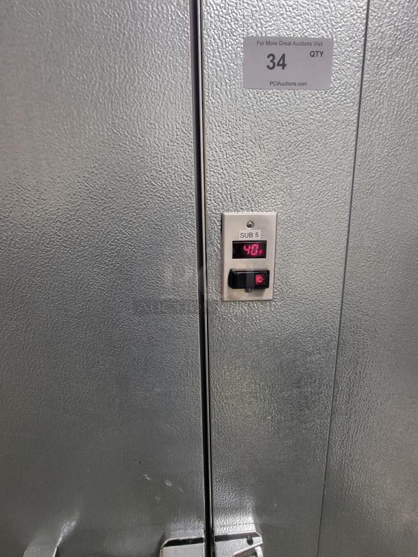 Norlake walk-in cooler and freezer combo with digital temperature display, excellent condition. Includes wall-mounted condensing units.