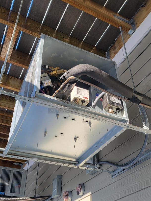 Wall-mounted condensing unit for Norlake walk-in cooler and freezer. Features robust construction and visible wiring. Excellent condition.