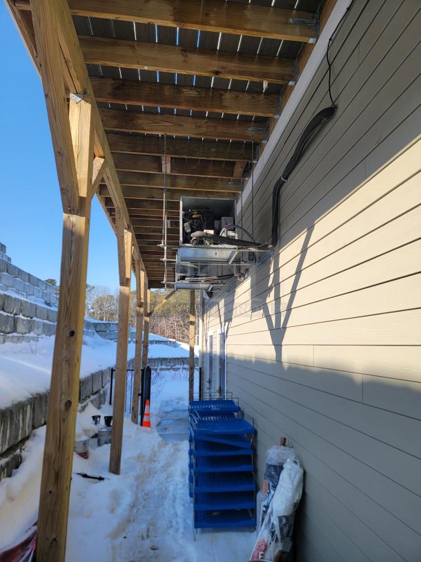 Commercial walk-in cooler and freezer combo by Norlake, with wall-mounted condensing units and blue Metro shelving.