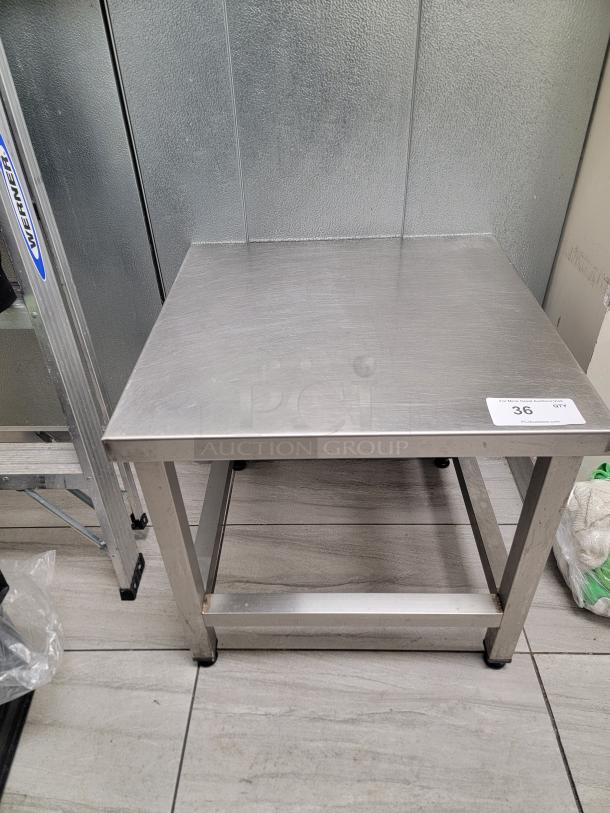 Heavy duty stainless steel equipment stand with adjustable leveling feet, ideal for heavy machinery; durable and easy to clean.