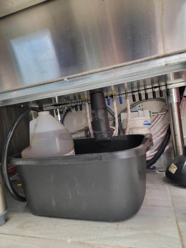 Krowne KR18-24-10 stainless steel ice bin with front speed rail, insulated well, under counter, NSF certified, visible plumbing.