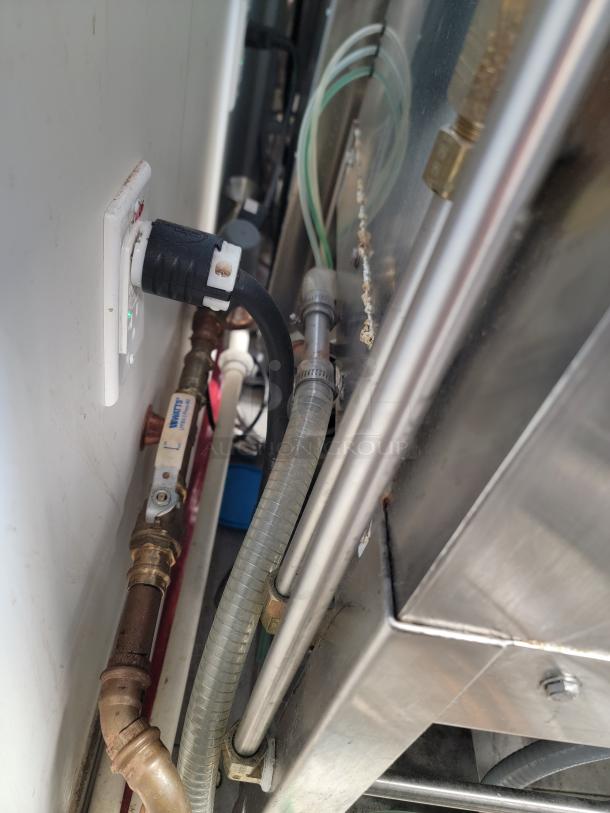 American Dish Service ET-AF-M-PH commercial dishwasher, stainless steel, connected to power and plumbing, excellent condition.