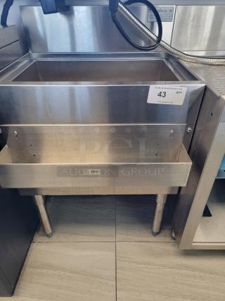 Krowne KR18-24-10 stainless steel ice bin with deep insulated well, front speed rail, and NSF certification tag visible.