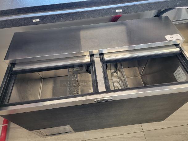 Sleek Krowne 48" Bottle Cooler, model BC48-BG, black vinyl exterior, stainless steel top, like new condition.