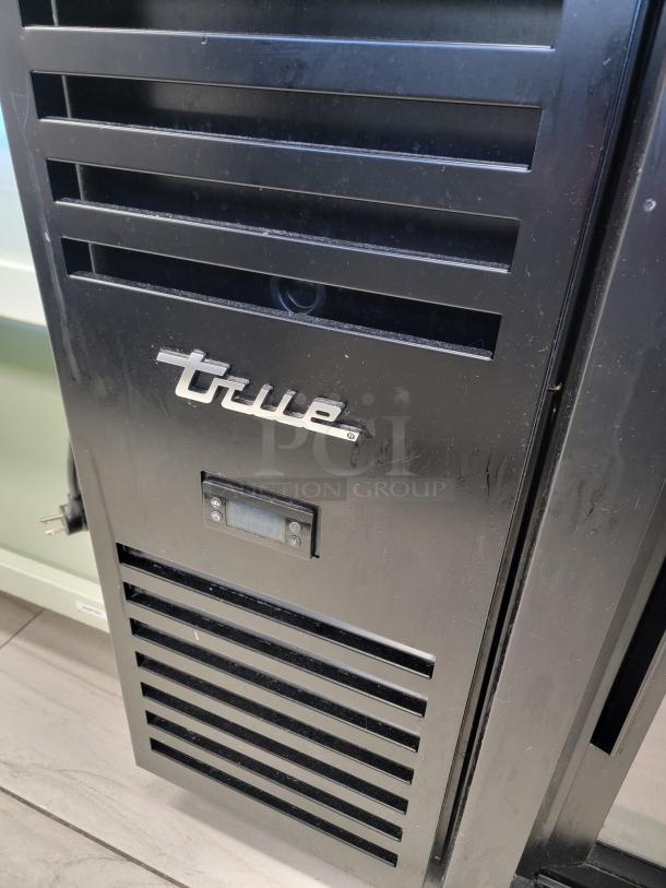 True 3-Door Glass Bar Refrigerator, Model TBR72-RISZ1-L-B-111-1, stainless steel countertop, excellent condition, visible digital display.