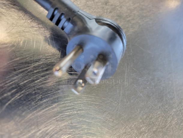 Power plug of a True Commercial Back Bar Cooler model TBR72-RISZ1-L-B-111-1.