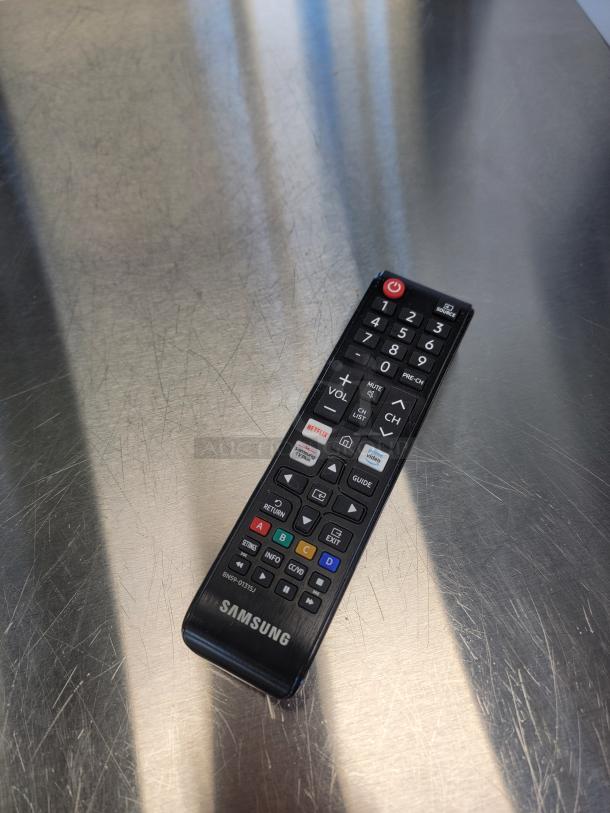 Samsung remote control on a reflective surface, labeled BN59-01315J, designed for easy navigation of Smart TV features.