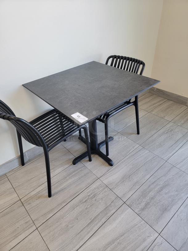 Lot of 18 composite slatted bistro chairs, matte black finish, ideal for dining, patios, cafes. Durable and weather-resistant.