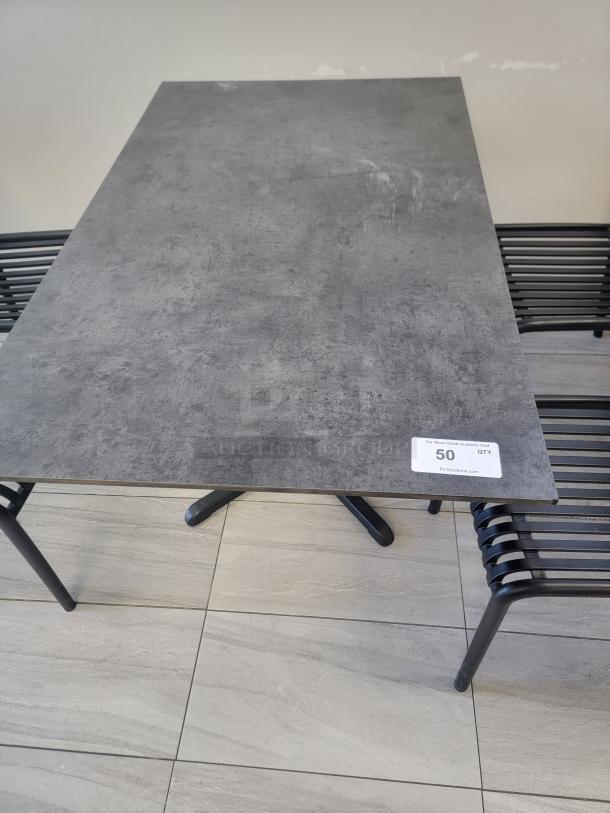 Set of 4 Flash Furniture rectangular hospitality tables, concrete-style laminate top, black cast-iron X-base, durable, modern.