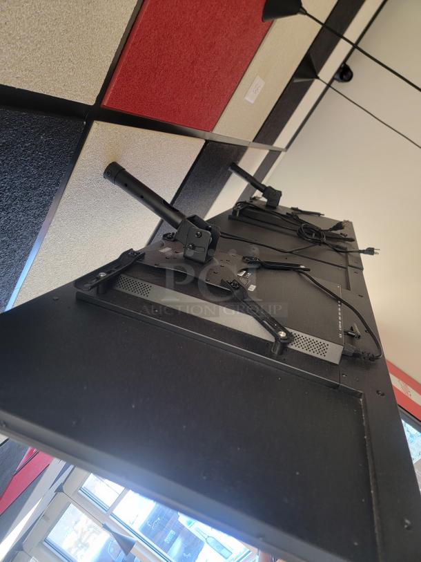 Set of 5 Samsung QM42 digital menu monitors, commercial-grade, with mounting brackets, for restaurant use, shown installed.